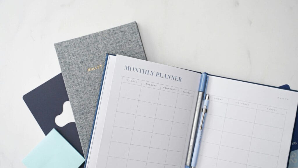 Monthly planners representing outsourced bookkeeping cost UK pricing plans