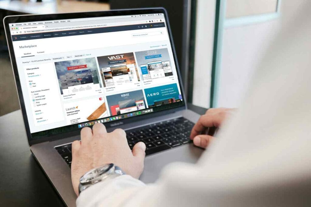 E-commerce store manager reviewing product listings on a laptop