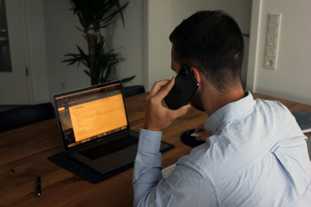 agent making outbound calls on a laptop