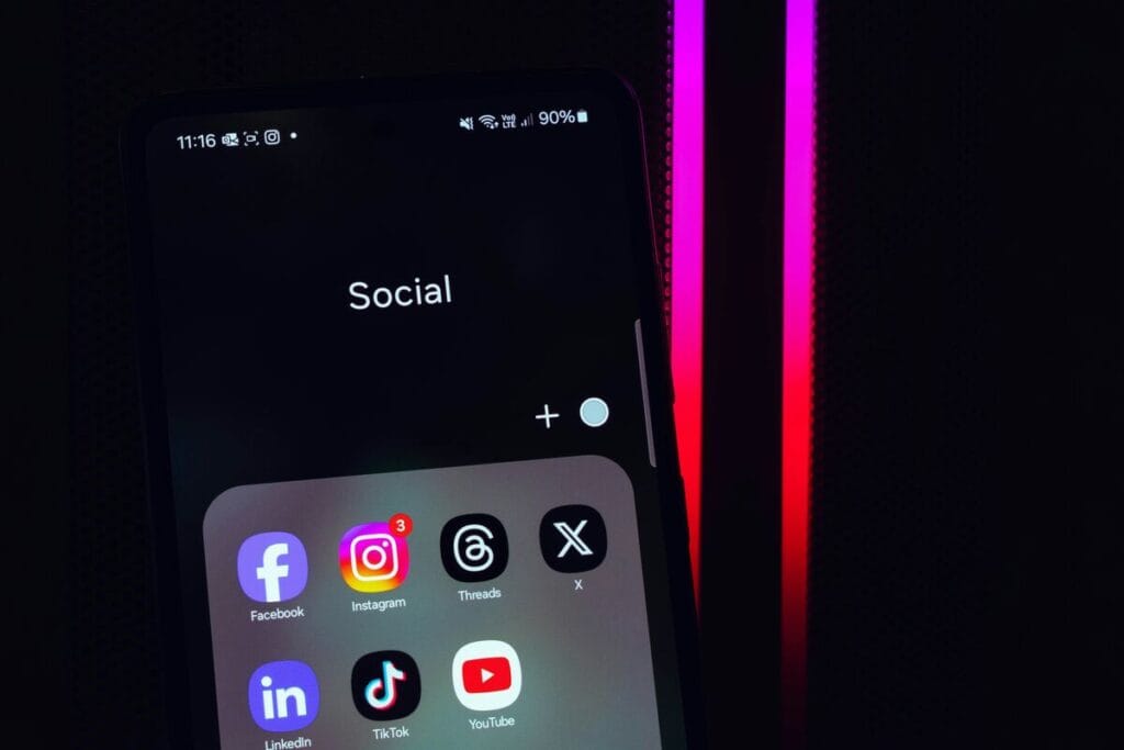 Smartphone screen showing social media apps including TikTok for online selling