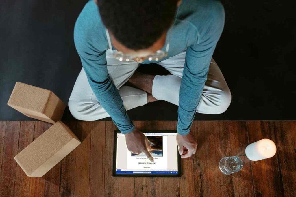 Small business owner managing order fulfilment and shipping packages using a tablet